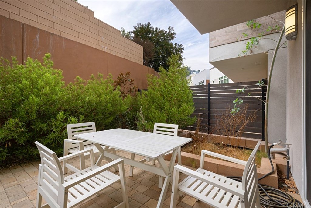 2771 Wright Lane Los Angeles, CA 90068 - Photo 19 of 31 a view of a patio with a table and chairs and potted plants