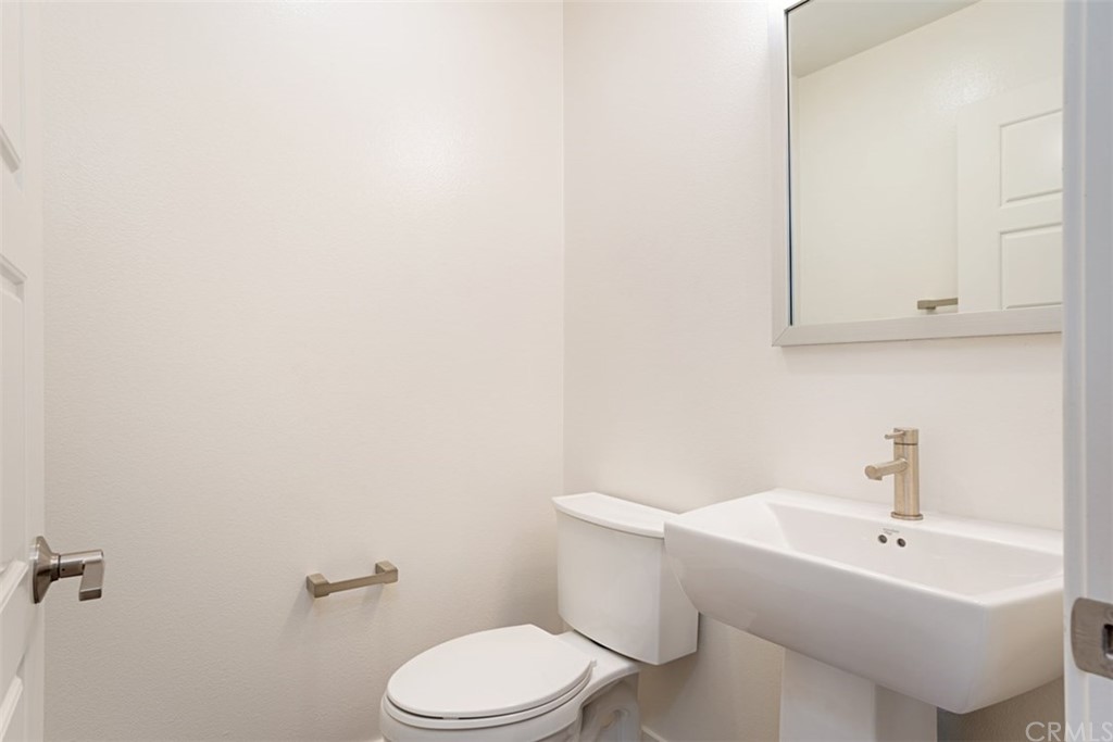2771 Wright Lane Los Angeles, CA 90068 - Photo 21 of 31 a white toilet sitting next to a white sink