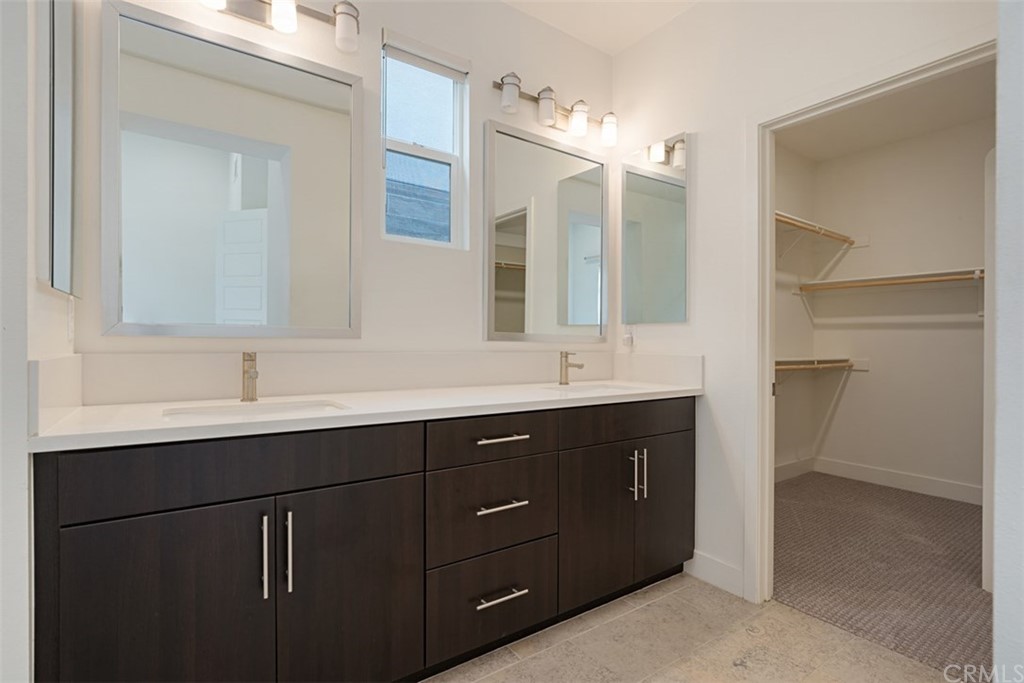 2771 Wright Lane Los Angeles, CA 90068 - Photo 29 of 31 a bathroom with a double vanity sink and mirror