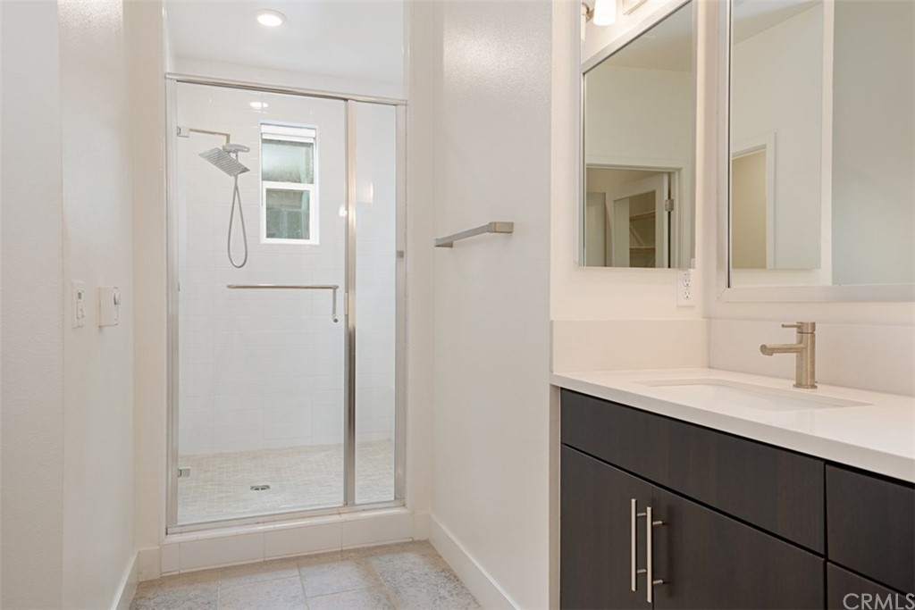 2771 Wright Lane Los Angeles, CA 90068 - Photo 30 of 31 a bathroom with a shower sink and mirror