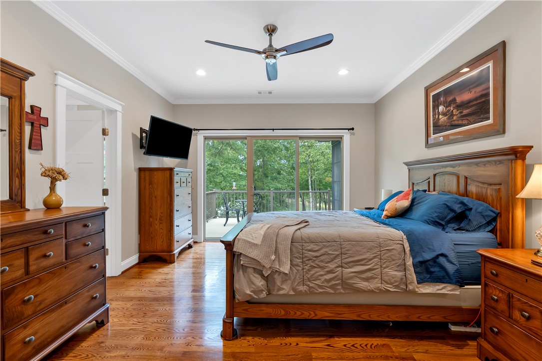 329 High Hampton Road Salem, SC 29676 - Photo 20 of 47 Hardwood floors and sliding glass doors leading to a private balcony define this comfortable bedroom.