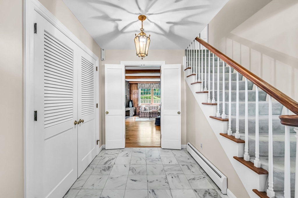 60 Longfellow Road Holyoke, MA 01040 - Photo 6 of 32 wooden floor view with staircase and living room