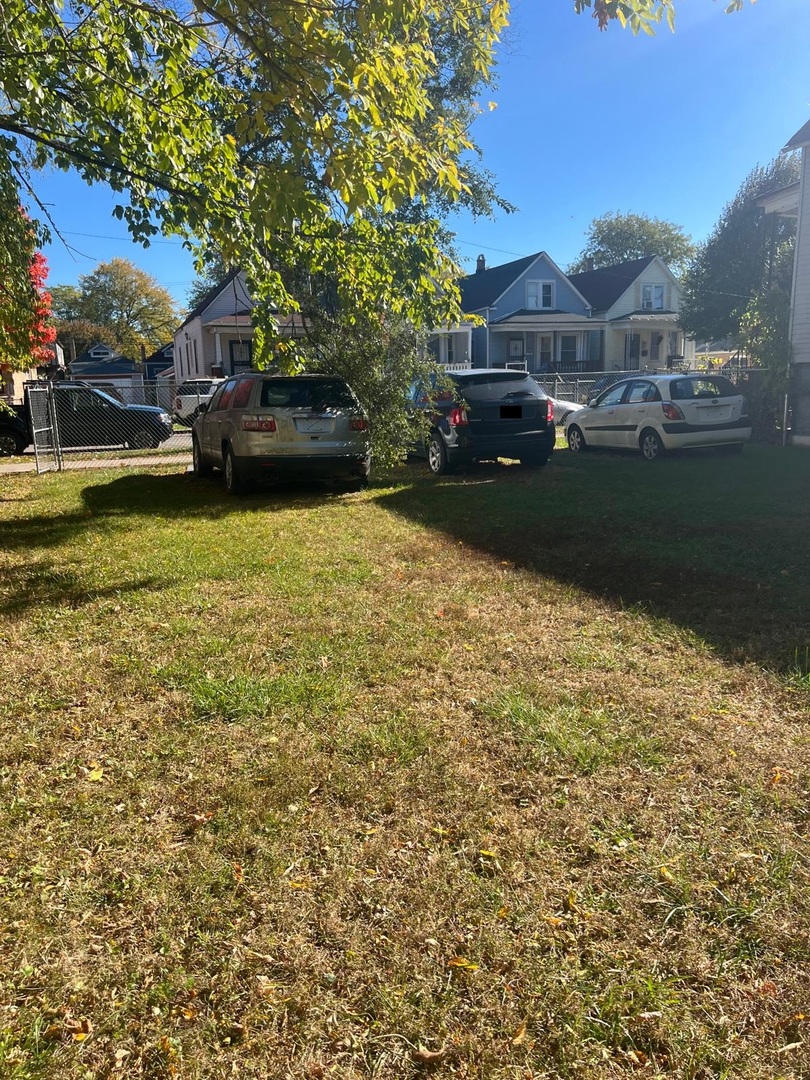 6824 South Honore Street Chicago, IL 60636 - Photo 3 of 6 a view of a lake with a house in the background