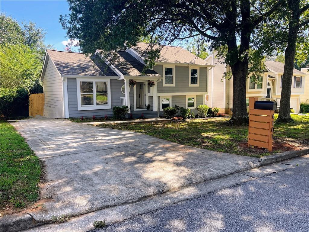 6101 Raintree Bend Lithonia, GA 30058 - Photo 1 of 1 a front view of a house with a yard