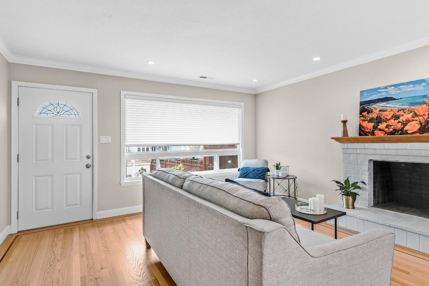 1475 Serra Drive Pacifica, CA 94044 - Photo 6 of 29 a living room with furniture and a fireplace
