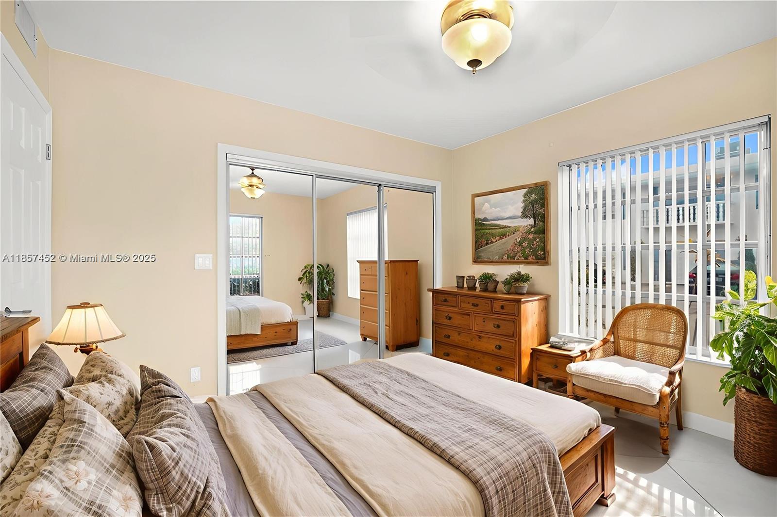 2171 Northeast 66th Street, Unit 801 Fort Lauderdale, FL 33308 - Photo 13 of 31 a bedroom with bed and wooden floor