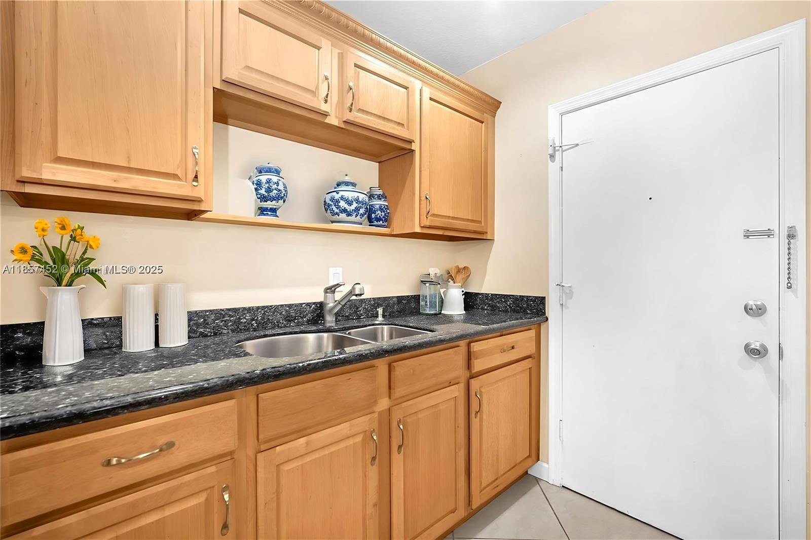 2171 Northeast 66th Street, Unit 801 Fort Lauderdale, FL 33308 - Photo 17 of 31 a bathroom with a sink and a mirror