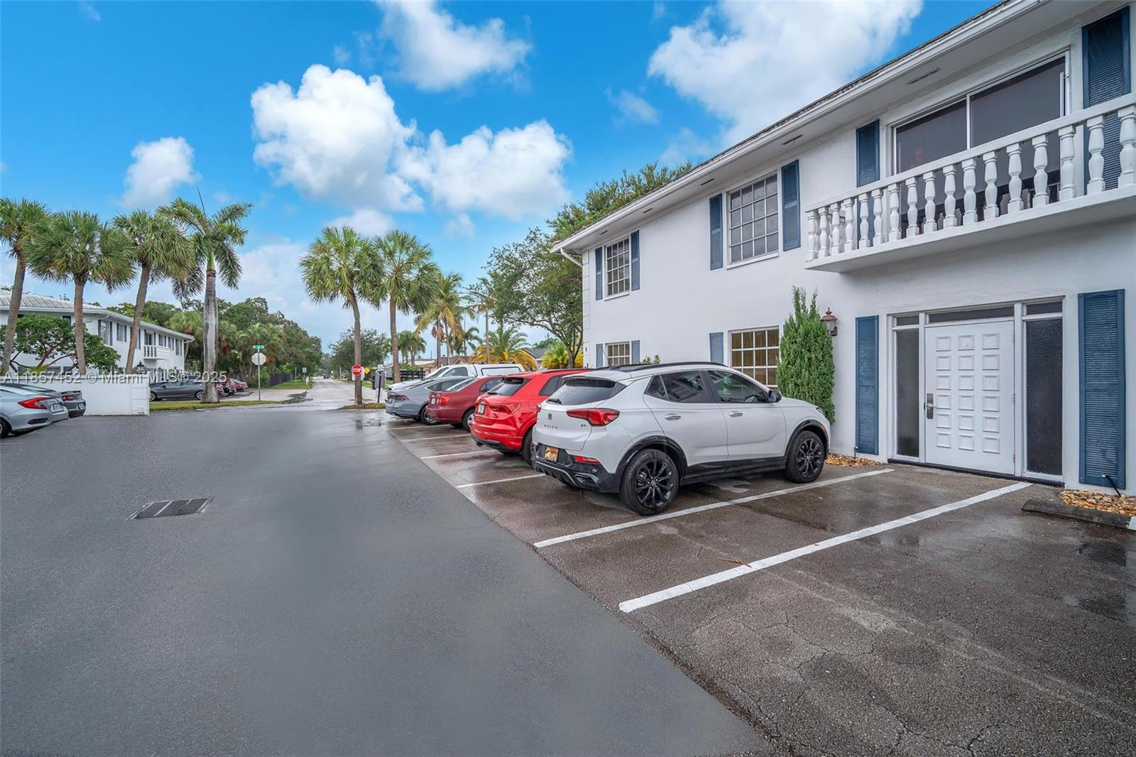 2171 Northeast 66th Street, Unit 801 Fort Lauderdale, FL 33308 - Photo 20 of 31 a view of a car parked in front of a house