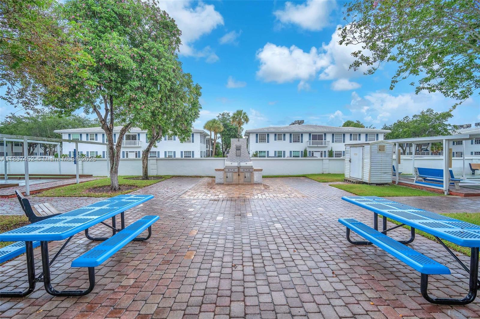 2171 Northeast 66th Street, Unit 801 Fort Lauderdale, FL 33308 - Photo 23 of 31 a view of a swimming pool with a lounge chair