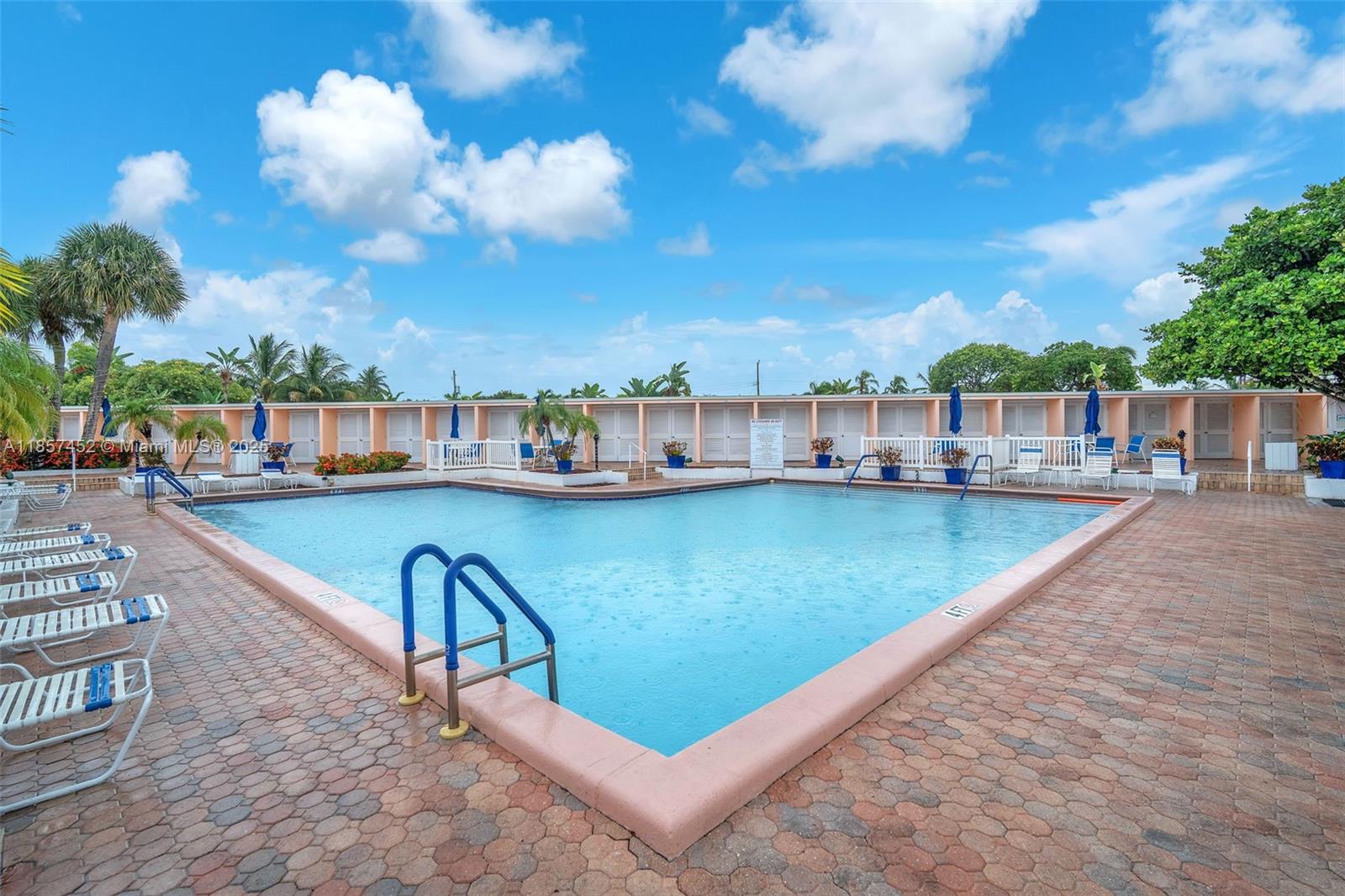 2171 Northeast 66th Street, Unit 801 Fort Lauderdale, FL 33308 - Photo 26 of 31 a view of swimming pool with seating area