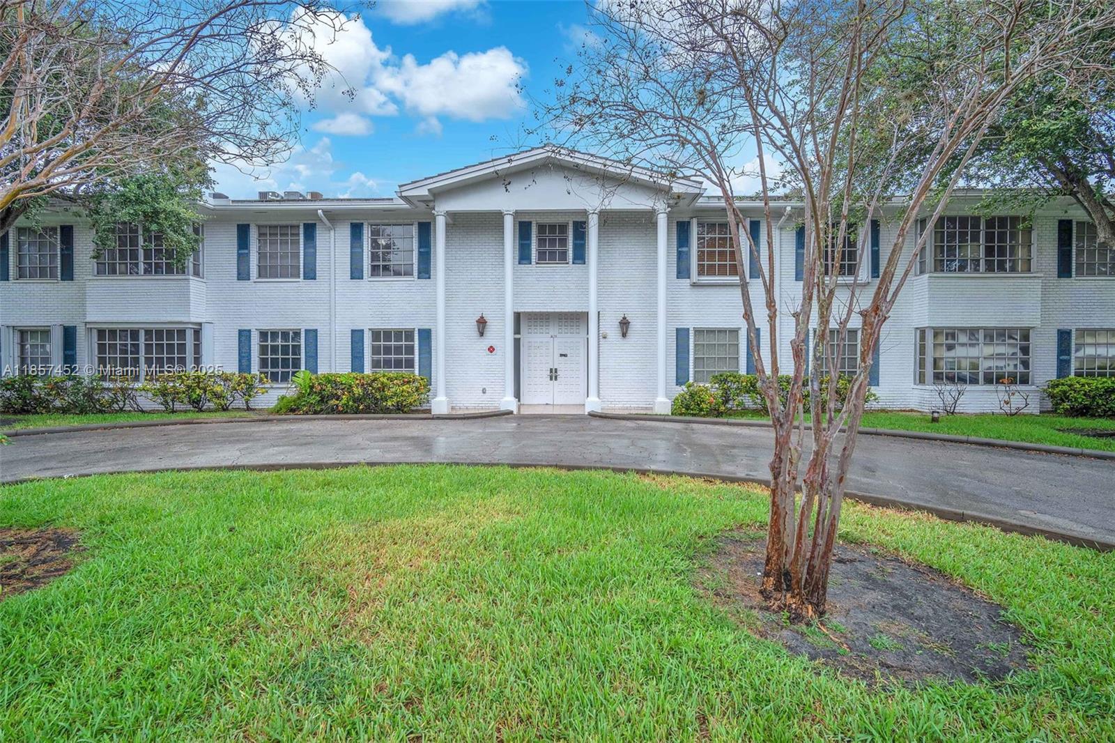 2171 Northeast 66th Street, Unit 801 Fort Lauderdale, FL 33308 - Photo 30 of 31 a front view of a house with a yard