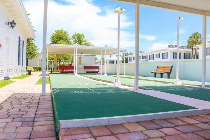2171 Northeast 66th Street, Unit 801 Fort Lauderdale, FL 33308 - Photo 6 of 31 a view of a house with a backyard and plants