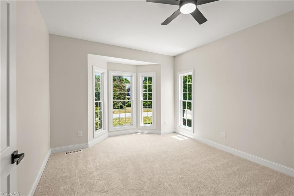 8419 Pheasant Ridge Drive Colfax, NC 27235 - Photo 23 of 49 Friends and family will love this main level Bedroom with streaming light!