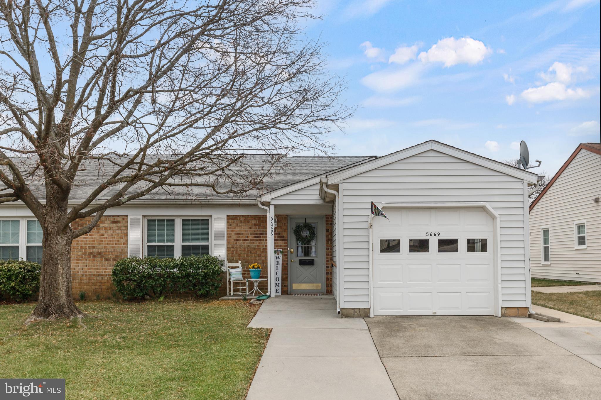 5669 Crabapple Drive Frederick, MD 21703 - Photo 1 of 24 a view of house with yard and a large tree