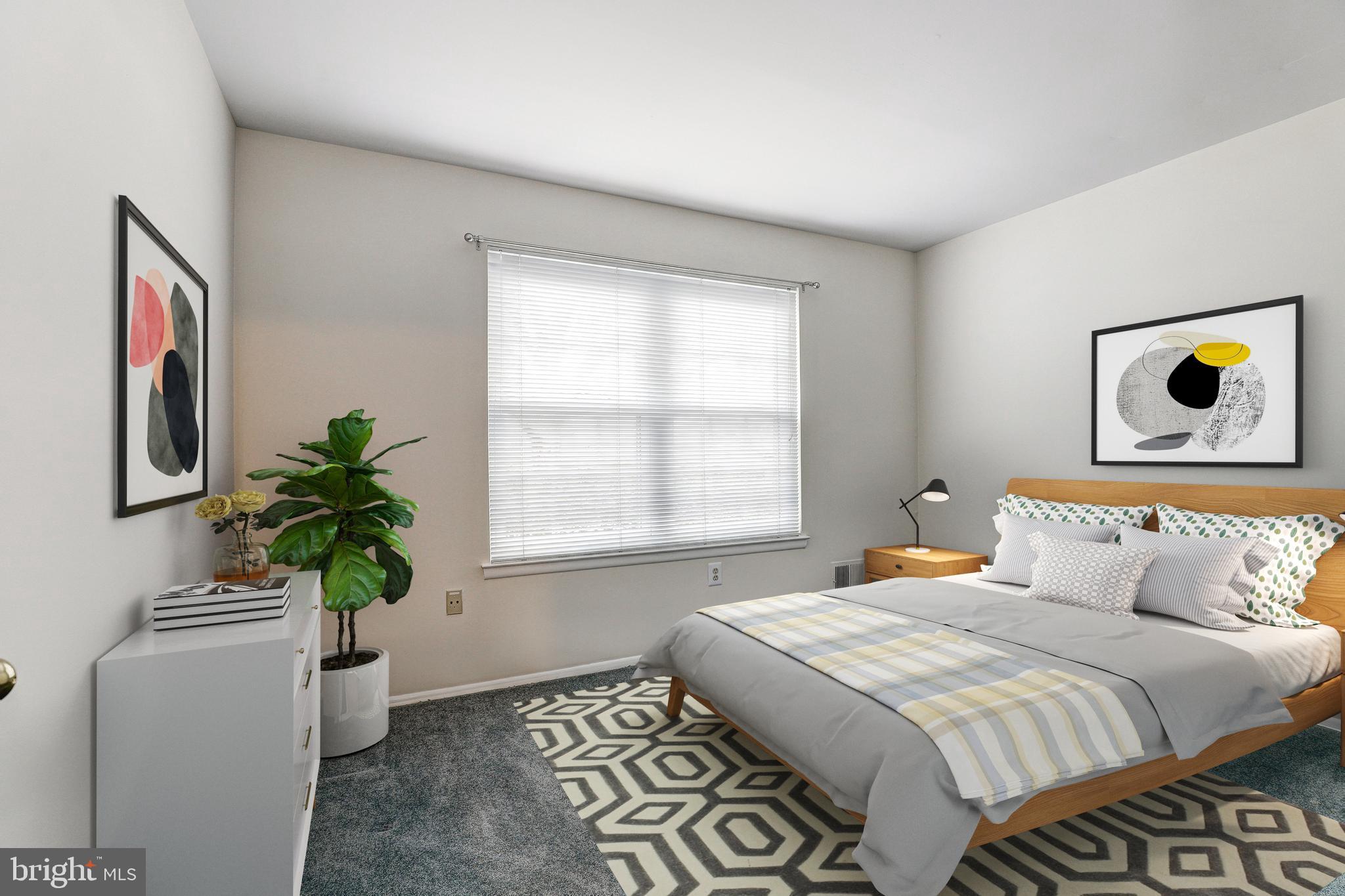 5669 Crabapple Drive Frederick, MD 21703 - Photo 7 of 24 a bedroom with a bed and a plant