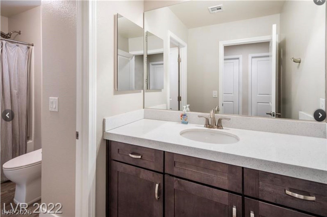 4631 Amazing View Street Las Vegas, NV 89129 - Photo 18 of 33 A well-appointed bathroom features a single vanity with ample counter space and a convenient shower.