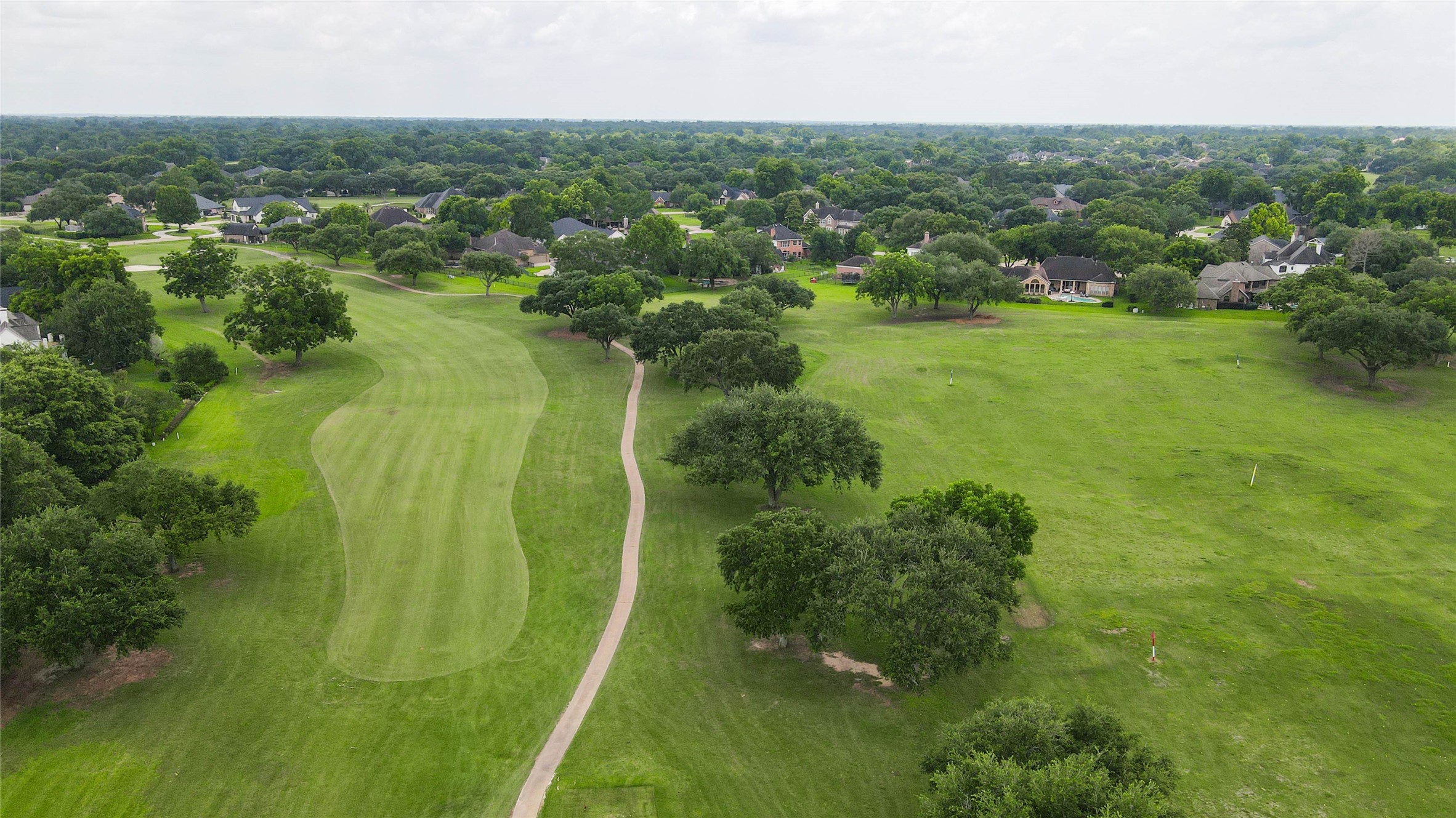 5327 Whitmore Fulshear, TX 77441 - Photo 47 of 50 The championship golf course at Weston Lakes winds through the community's picturesque landscape, offering beautiful fairways, scenic water features, and mature trees that create a truly exceptional setting.