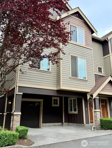 a front view of a house with a garage