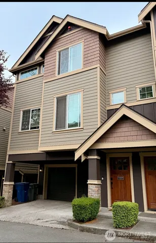 a front view of a house with a garage