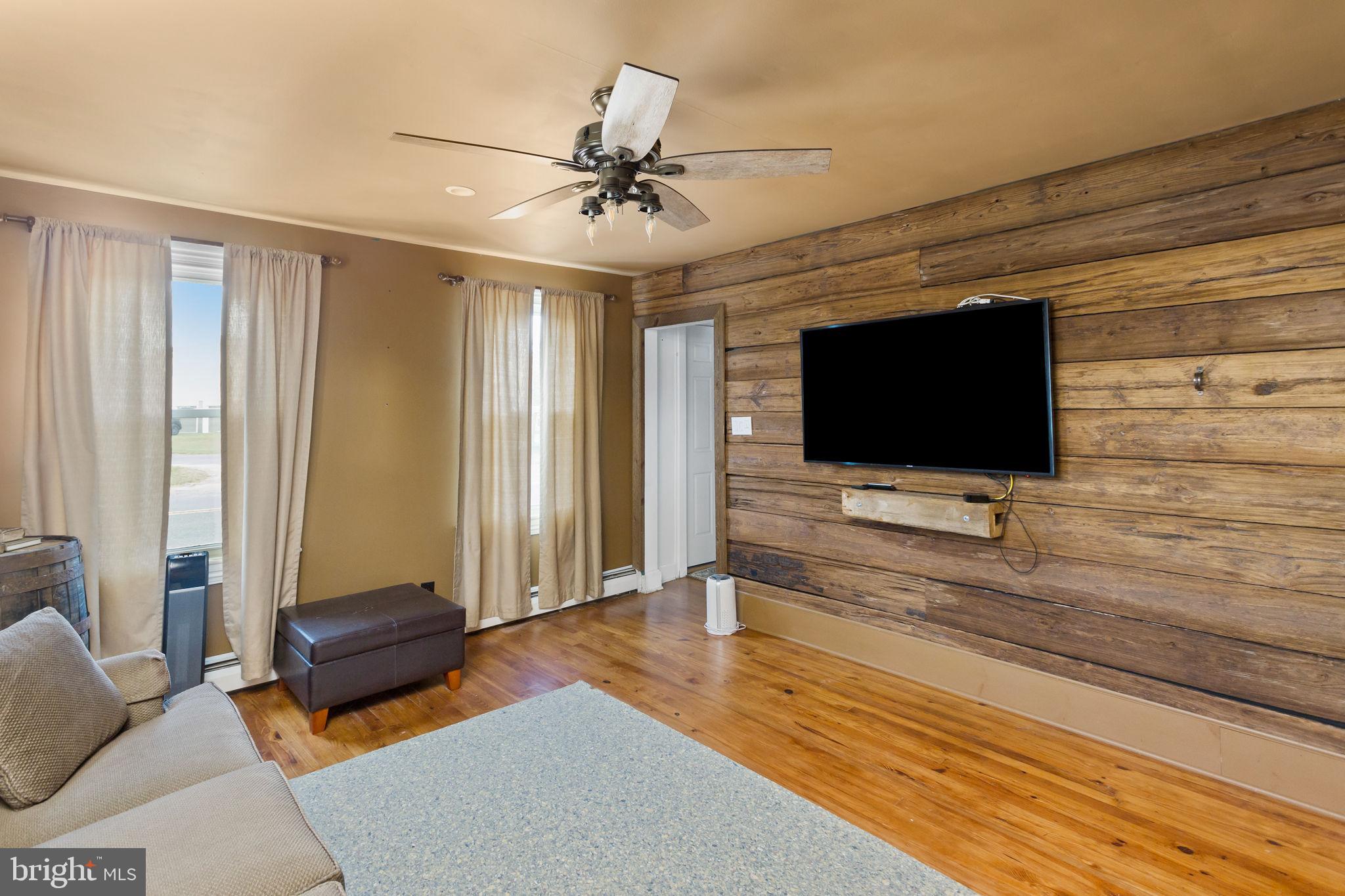418 Jacobstown Cookstown Road Wrightstown, NJ 08562 - Photo 11 of 30 a living room with furniture and a flat screen tv