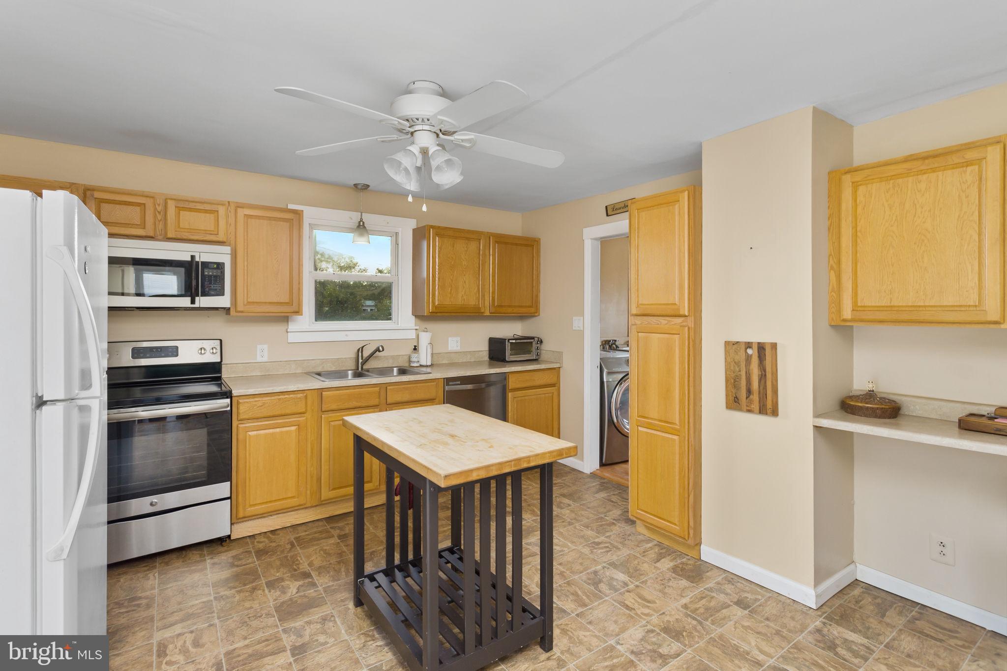 418 Jacobstown Cookstown Road Wrightstown, NJ 08562 - Photo 12 of 30 a large kitchen with stainless steel appliances granite countertop a stove refrigerator and a sink