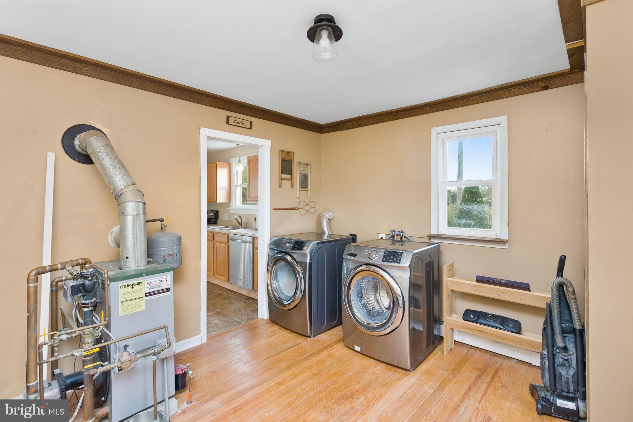 418 Jacobstown Cookstown Road Wrightstown, NJ 08562 - Photo 16 of 30 a utility room with dryer washer and a view of living room