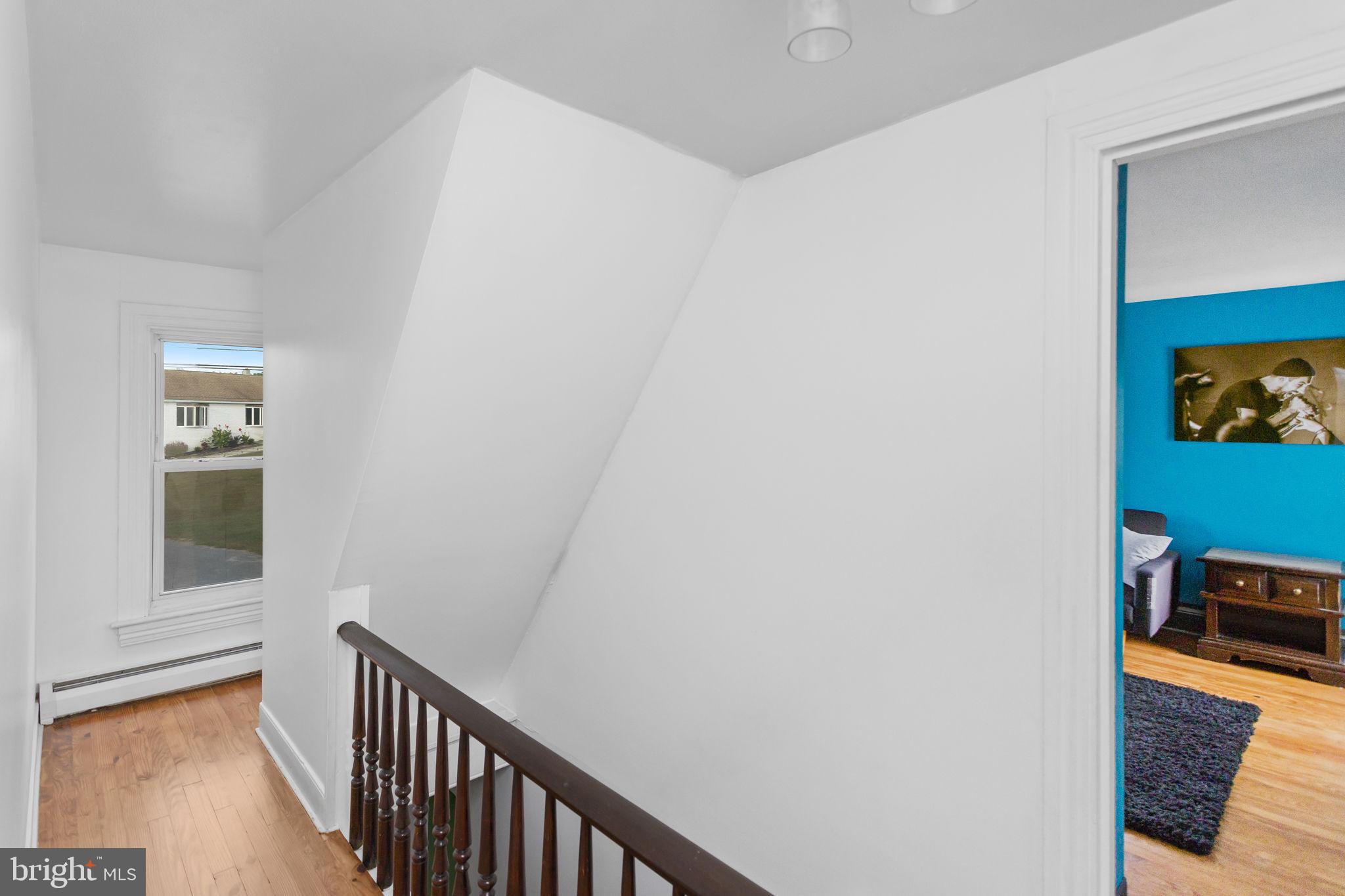 418 Jacobstown Cookstown Road Wrightstown, NJ 08562 - Photo 17 of 30 a view of a hallway with wooden floor and a living room