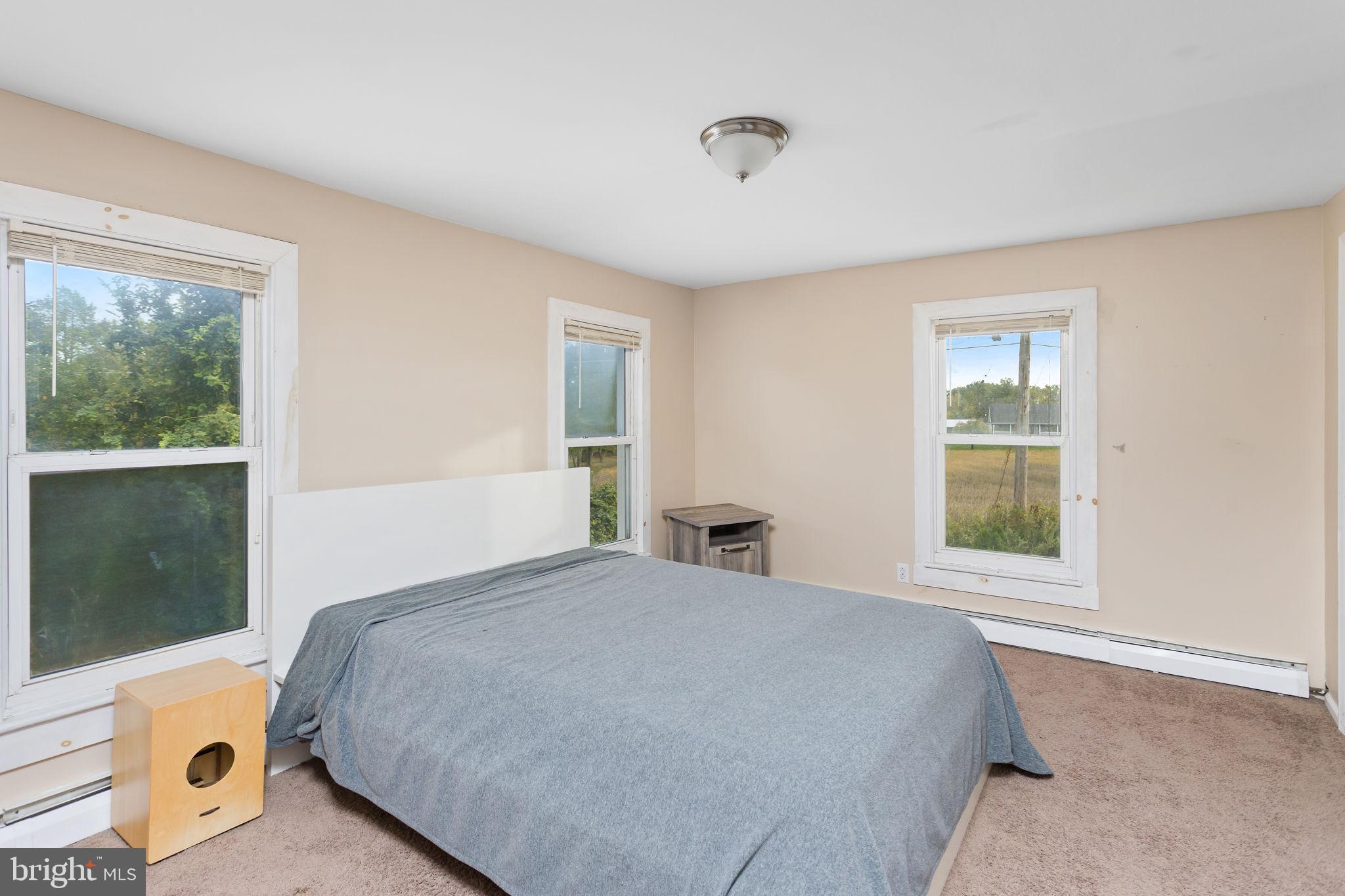 418 Jacobstown Cookstown Road Wrightstown, NJ 08562 - Photo 20 of 30 a bedroom with a bed and a window