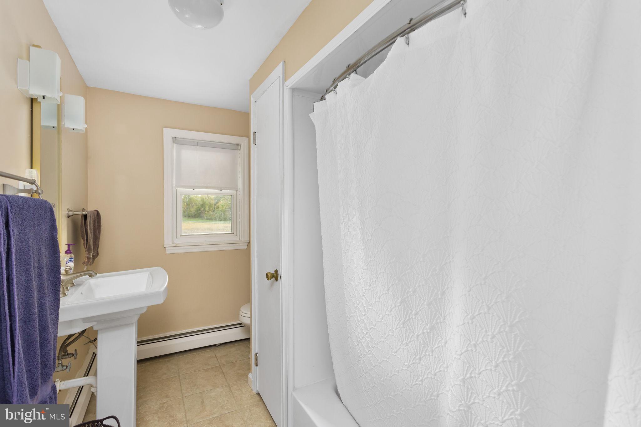 418 Jacobstown Cookstown Road Wrightstown, NJ 08562 - Photo 22 of 30 a bathroom with a sink toilet and a mirror