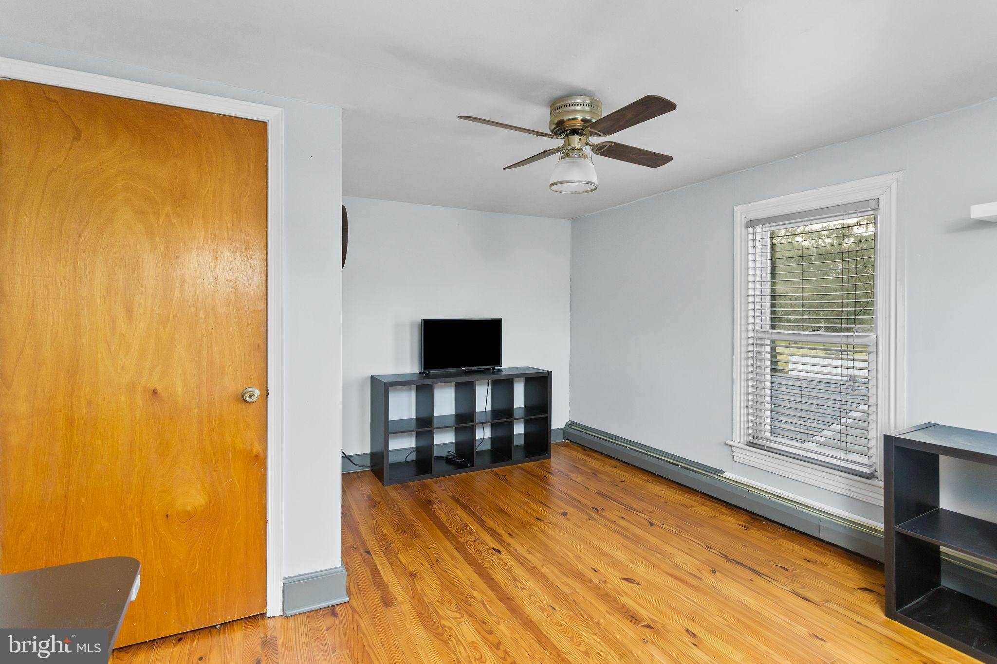 418 Jacobstown Cookstown Road Wrightstown, NJ 08562 - Photo 24 of 30 a bedroom with a bed and a flat tv screen on the table
