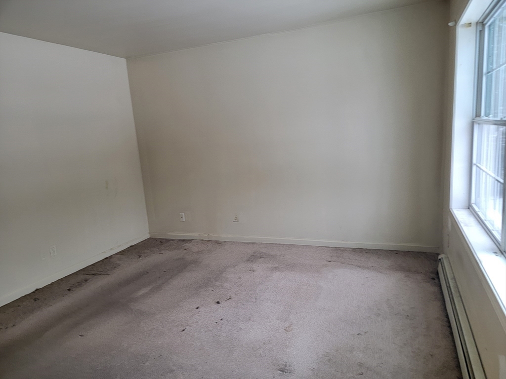 524 South Main Street Orange, MA 01364 - Photo 12 of 19 an empty room with a window