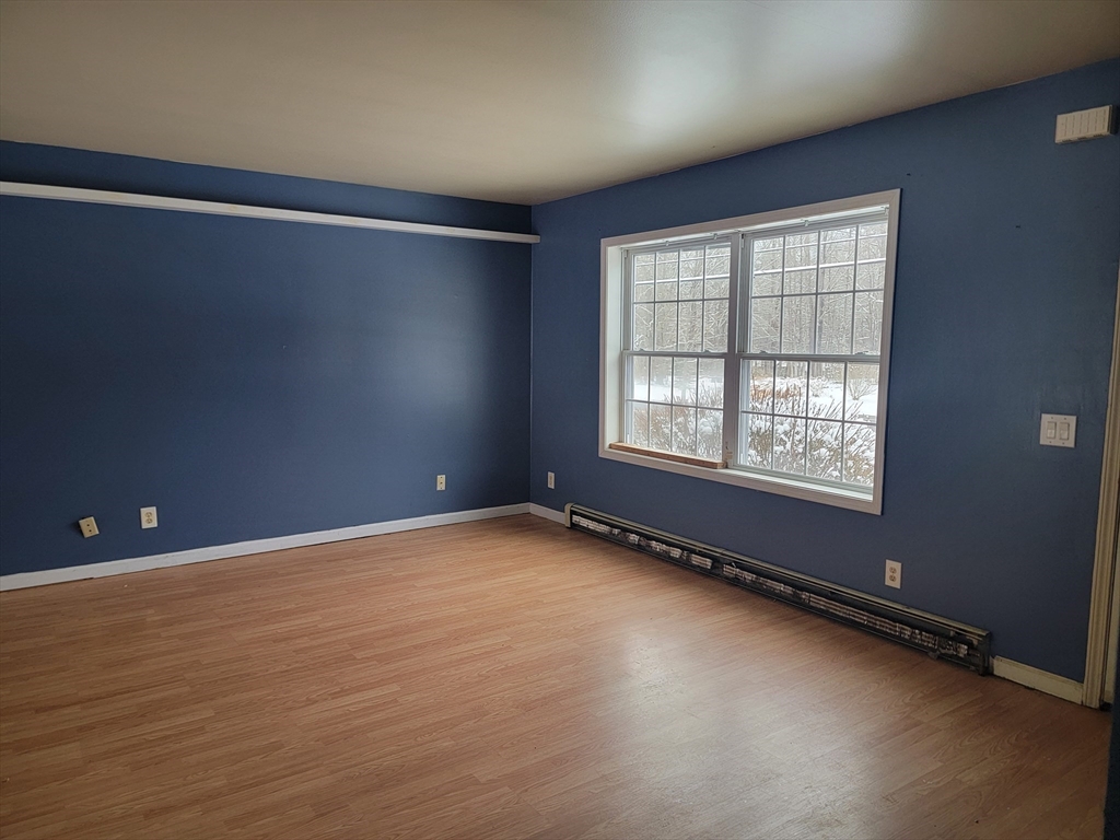 524 South Main Street Orange, MA 01364 - Photo 2 of 19 a view of an empty room with a window