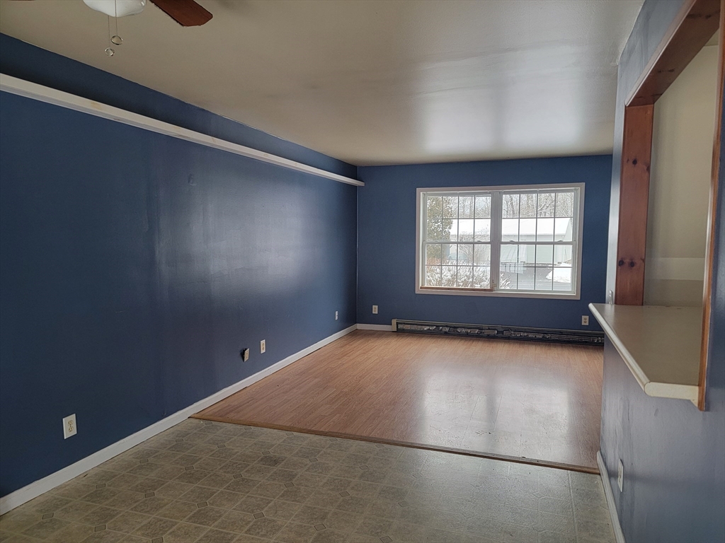 524 South Main Street Orange, MA 01364 - Photo 5 of 19 an empty room with windows