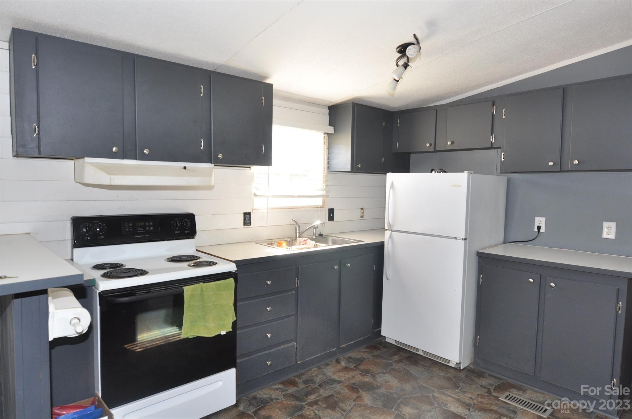 887 Cornwell Road Chester, SC 29706 - Photo 4 of 17 a kitchen with a cabinets and white appliances