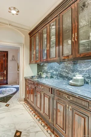 a kitchen with stainless steel appliances granite countertop a stove a sink and a granite counter tops