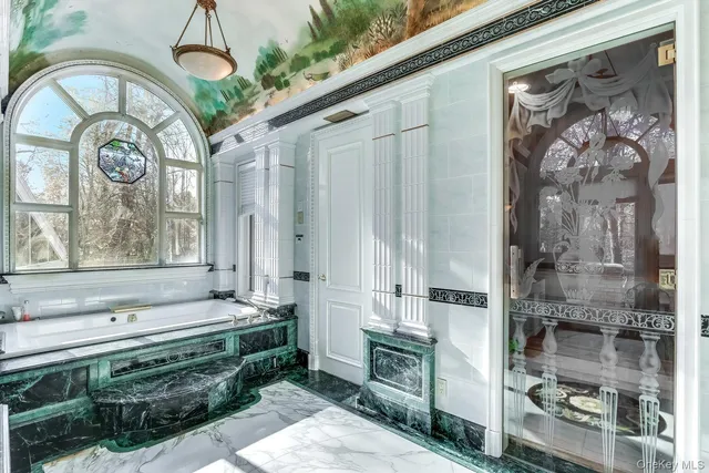 a bathroom with a sink a mirror and a shower