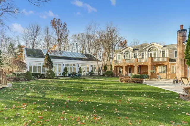 a front view of a building with a garden