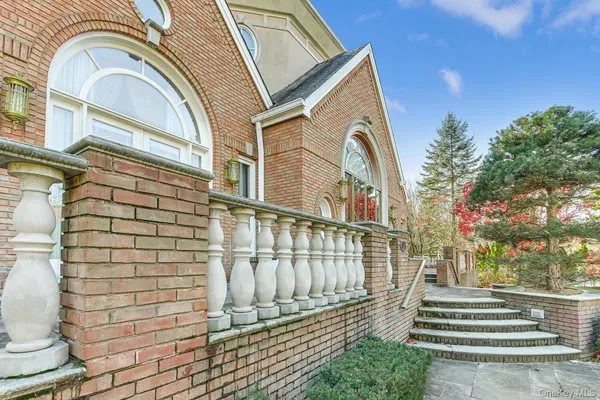 a view of a brick building with many windows