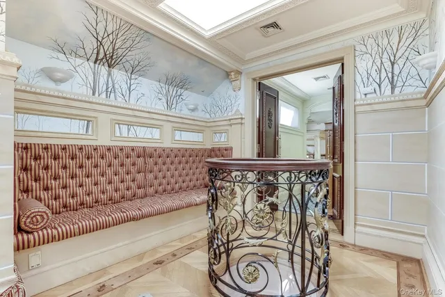 a bedroom with a large bed and a large window