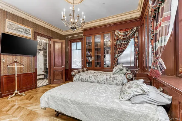 a bed room with furniture and a tv