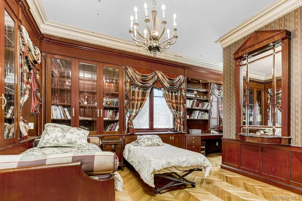 a kitchen with stainless steel appliances granite countertop a refrigerator a stove a sink and a granite counter tops with white cabinets