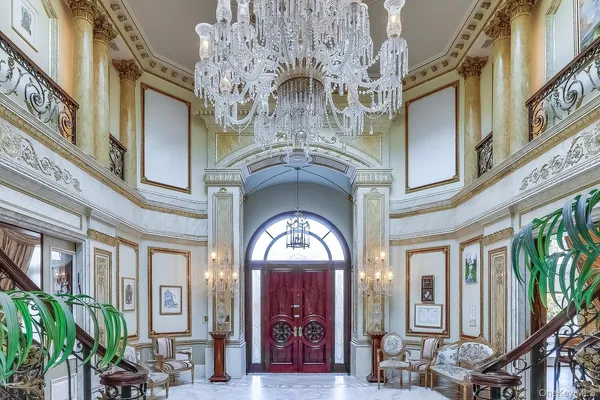 a view of a hallway with chandelier