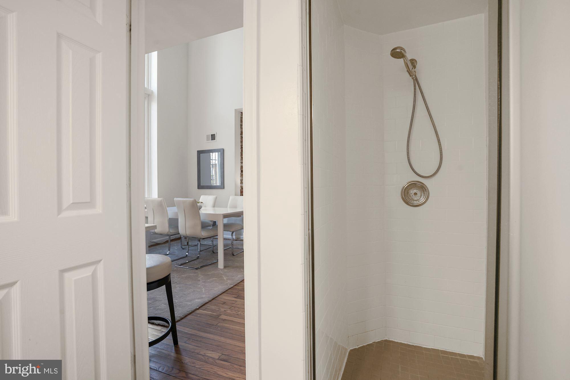 642 Pickford Place Northeast Washington, DC 20002 - Photo 14 of 33 First floor half bath surprise! A stall shower!