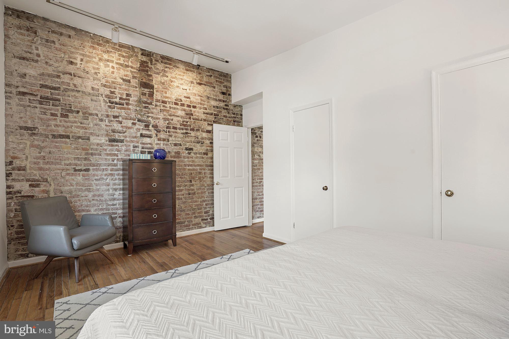 642 Pickford Place Northeast Washington, DC 20002 - Photo 19 of 33 Exposed brick in primary bedroom