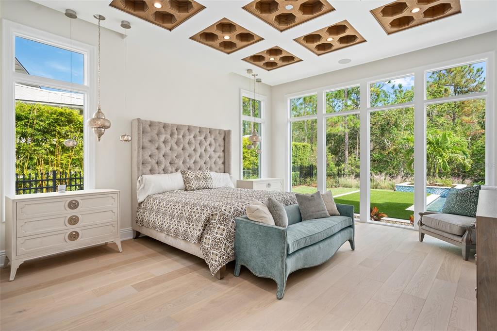 10065 Autumn Mist Lane Orlando, FL 32836 - Photo 12 of 65 a spacious bedroom with a bed and a large window