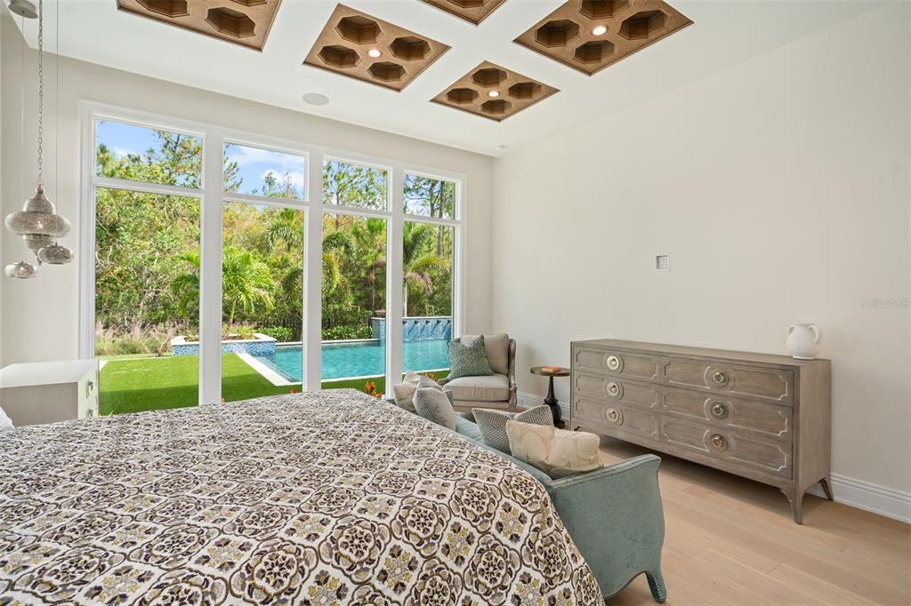 10065 Autumn Mist Lane Orlando, FL 32836 - Photo 13 of 65 a bedroom with a bed and a large window