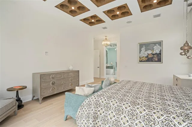 a spacious bathroom with a tub a double vanity sink and shower