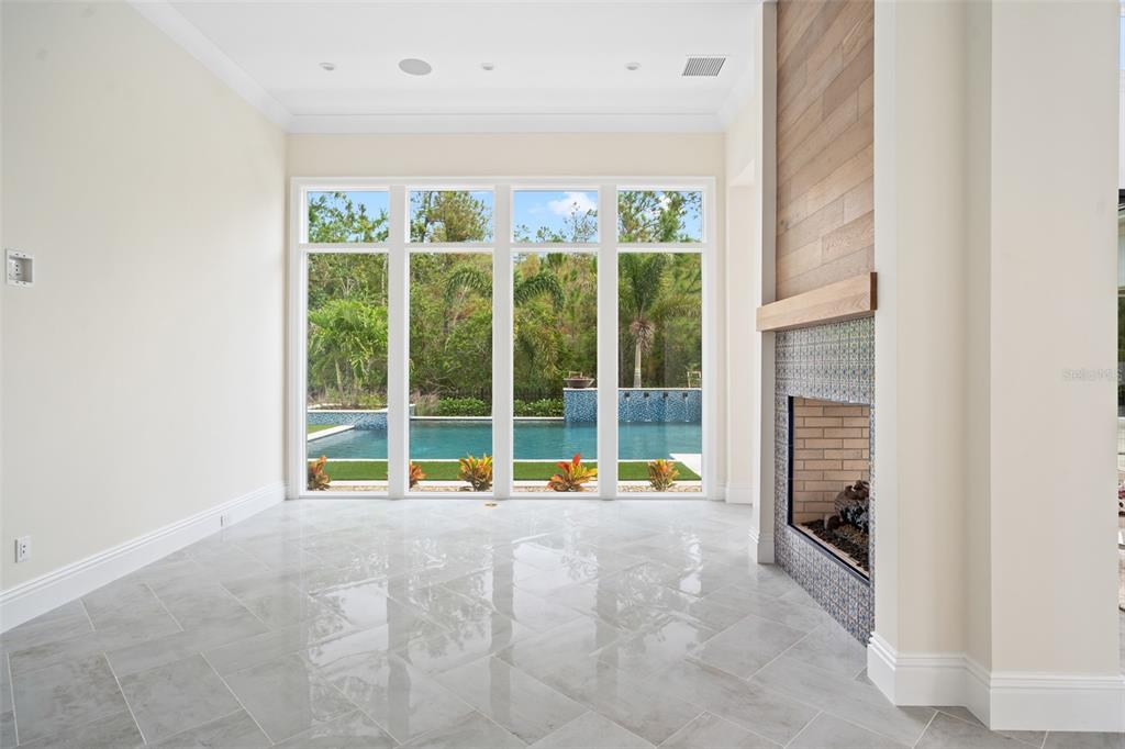10065 Autumn Mist Lane Orlando, FL 32836 - Photo 19 of 65 a view of an empty room with a floor to ceiling window and an outdoor view