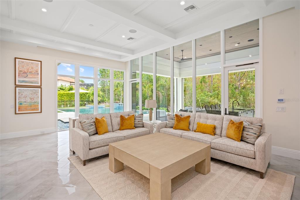 10065 Autumn Mist Lane Orlando, FL 32836 - Photo 22 of 65 a living room with furniture and a large window