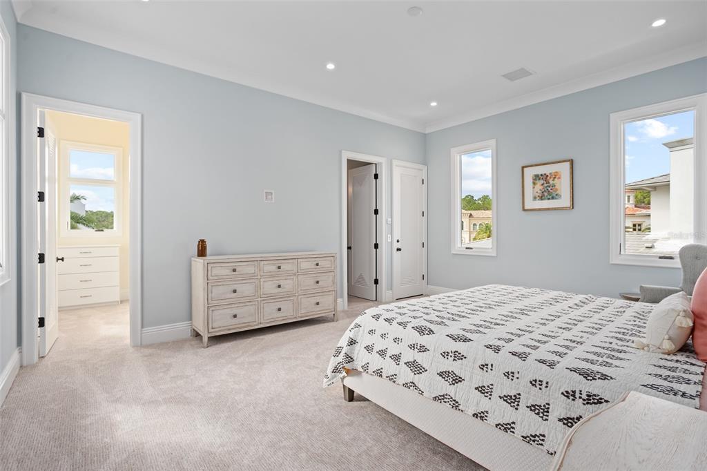 10065 Autumn Mist Lane Orlando, FL 32836 - Photo 43 of 65 a bedroom with a bed and a cabinets